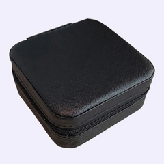 Black zippered case on a light purple background