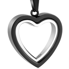 Heart-shaped pendant with black and silver design on a white background