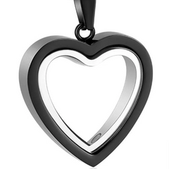 Heart-shaped pendant with black and silver design on a white background