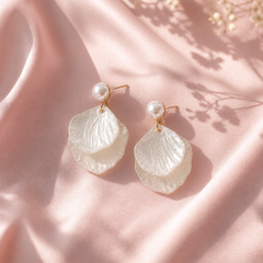White mother‑of‑pearl double shell dangle earrings with gold‑tone metal accents, lightweight and elegant.