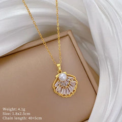Gold necklace with a pendant on a beige surface