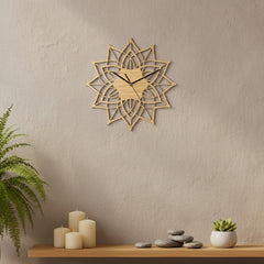 Decorative wall clock with geometric design on a white background