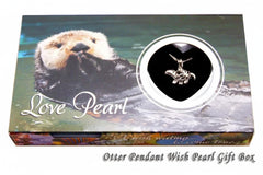 Gift box for an otter pendant wish pearl, featuring a photo of an otter on the front with a circular cutout showing a silver-toned otter pendant inside a black heart-shaped setting. The box has the text 'Love Pearl' and 'Otter Pendant Wish Pearl Gift Box'.