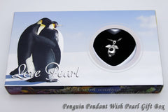Penguin pendant wish pearl gift box with penguin illustration on a blue background