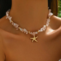 Necklace with starfish charm on a person's neck