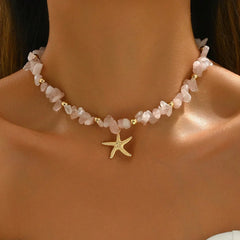 Necklace with starfish charm on a person's neck