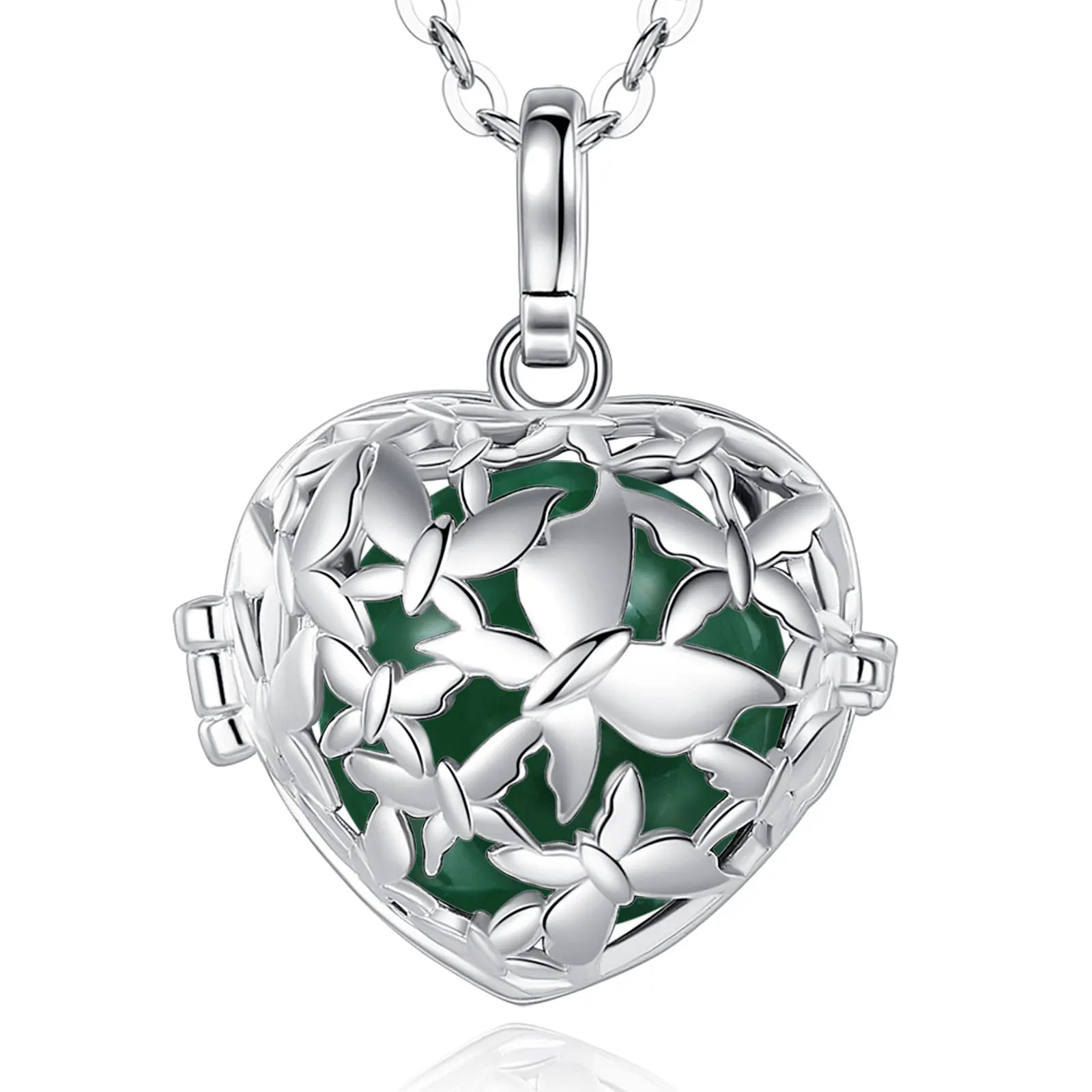A silver heart-shaped locket pendant necklace with a butterfly cutout design and a dark green enamel background, shown on a white background with a faint reflection below.