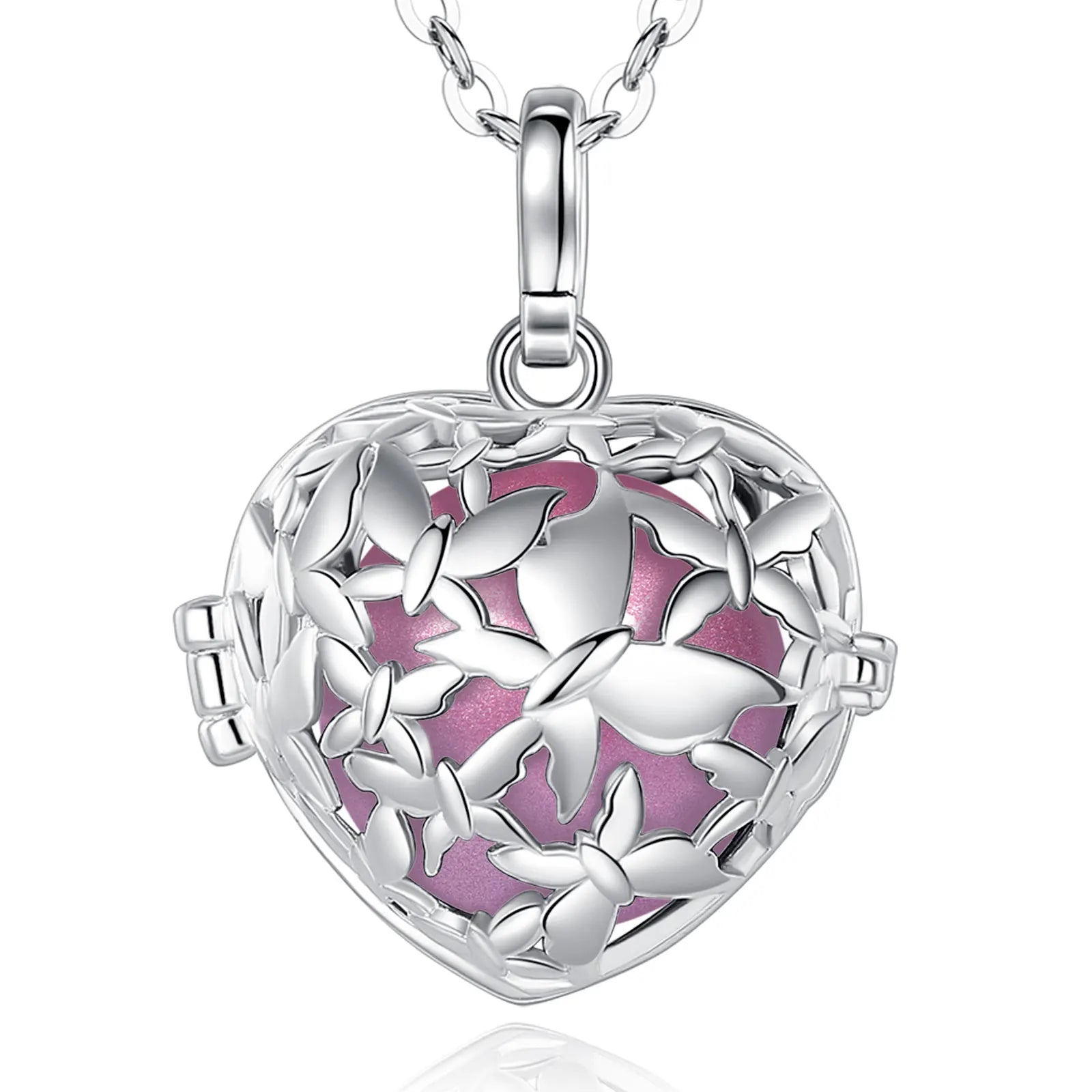 A silver heart-shaped locket pendant necklace with a butterfly cutout design and a pink enamel background, shown on a white background with a reflection below.