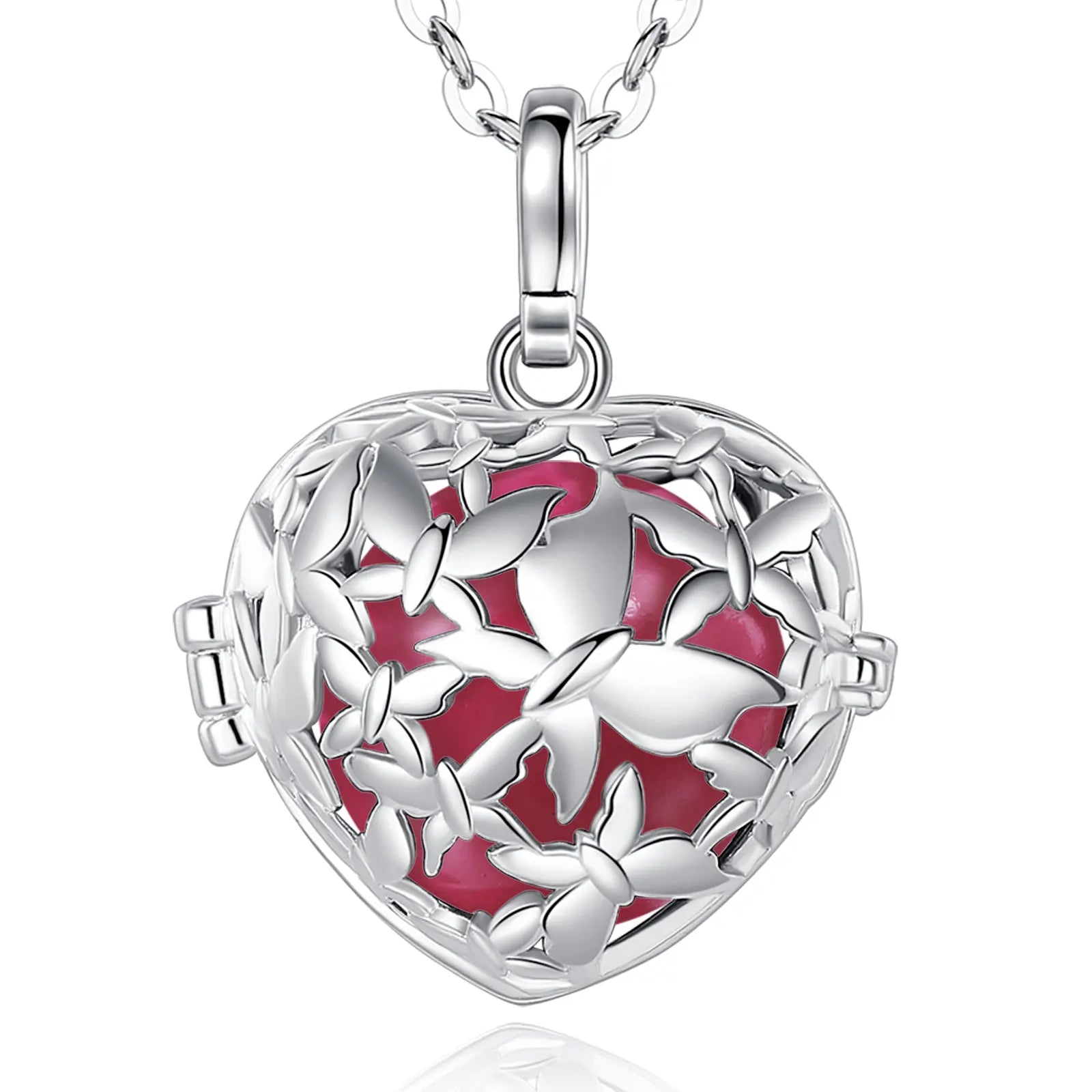 A silver heart-shaped locket pendant necklace with a butterfly design and a vibrant redish pink enamel background, shown on a white background with a subtle reflection.