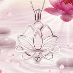A silver lotus flower pendant necklace on a matching chain, shown against spa like background with a magenta lotus flower in the top right.