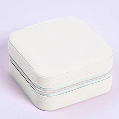 White Jewelry travel case on a light purple background