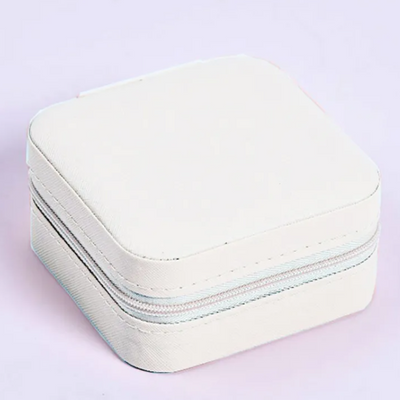 White Jewelry travel case on a light purple background