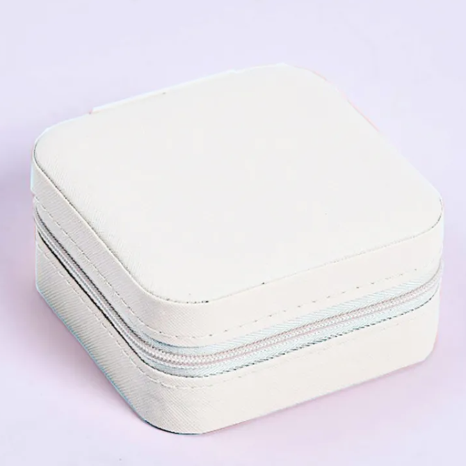 White Jewelry travel case on a light purple background