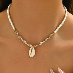 Necklace with shell pendant on a mannequin
