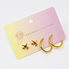 Gold earrings on a Ellison + Young branded card with a pink and yellow gradient background.