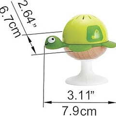 Green turtle suction rattle size diagram showing a 7.9 cm width and 6.7 cm height.