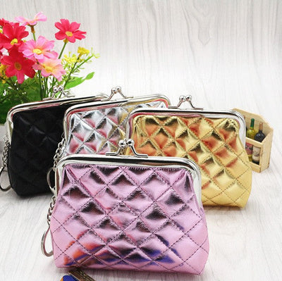 Four textured Lingge coin purses with diamond‑pattern surface and clasp closures in black, silver, gold, and pink