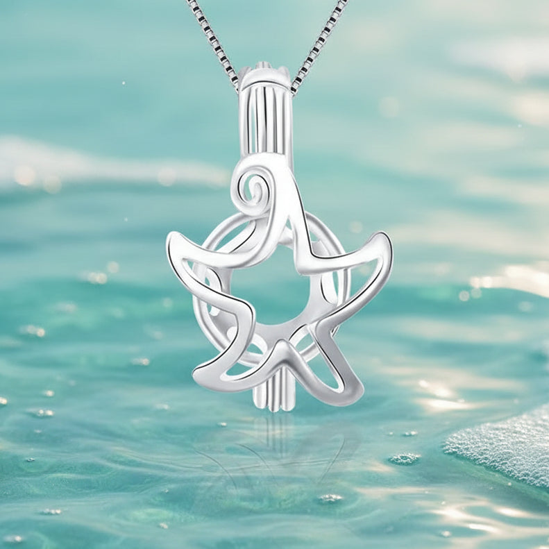 A sterling silver starfish pearl cage against aqua colored water and bubbles background
